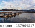 Evening view of the lake and moored fishing boats 137964817