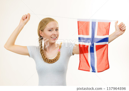Young woman with norwegian flag 137964896