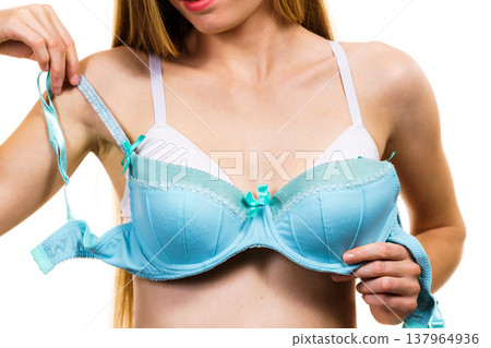 Woman choosing underwired bra Woman choosing underwired bra 137964936