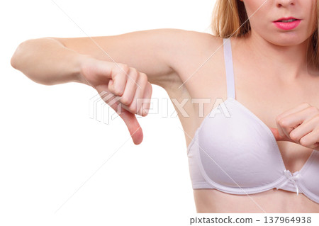 Woman dissatisfied with size of bra breasts Woman dissatisfied with size of bra breasts 137964938