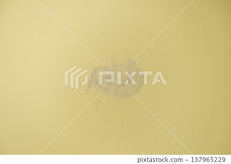 Plastered with gypsum hole in the yellow wall Plastered with gypsum hole in the yellow wall 137965229