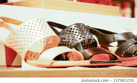 Shelf in shop with summer shoes sandal Shelf in shop with summer shoes sandal 137965250