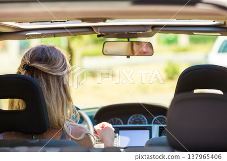 Woman driving car Woman driving car 137965406