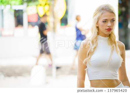 Woman wearing crop top and culottes 137965420