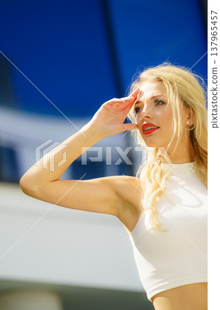 Blonde woman in city 137965457