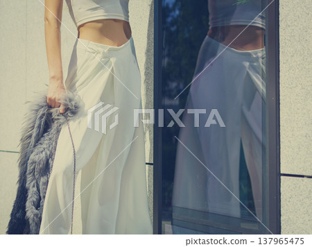 Woman wearing crop top and culottes Woman wearing crop top and culottes 137965475