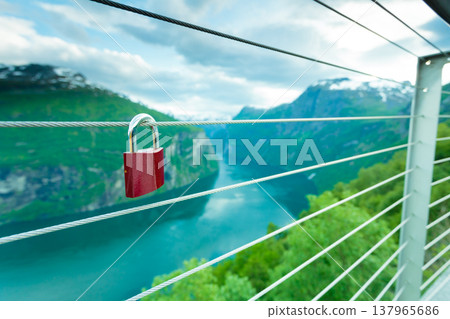 Red padlock and Geirangerfjord from Flydasjuvet viewpoint Norway 137965686