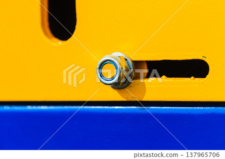 Detailed closeup of screw on indrustrial machinery Detailed closeup of screw on indrustrial machinery 137965706