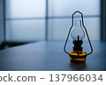A lantern placed by the window 137966034