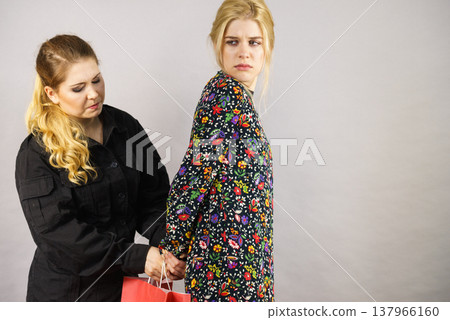 Security guard and shoplifter. Security guard and shoplifter. 137966160