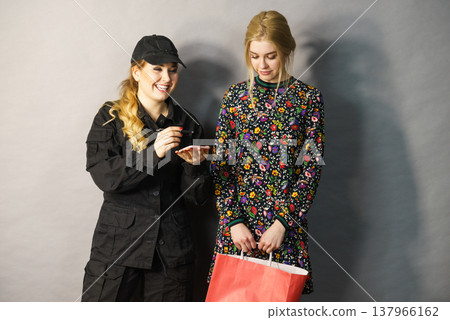 Security guard and blonde girl . Security guard and blonde girl . 137966162