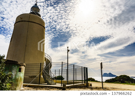 Lighthouse and Gibraltar rock, La Alcaidesa, Spain. Lighthouse and Gibraltar rock, La Alcaidesa, Spain. 137966262
