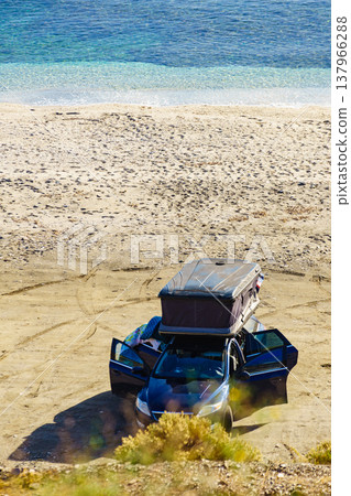Car with roof top tent camping on beach Car with roof top tent camping on beach 137966288