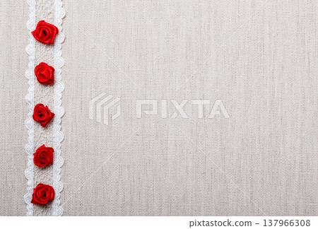 Frame of red silk roses on cloth Frame of red silk roses on cloth 137966308