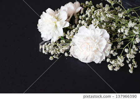 The picture shows white flowers that symbolize the theme of funerals and condolences. The picture shows white flowers that symbolize the theme of funerals and condolences. 137966390
