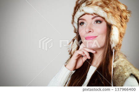 woman in winter clothing fur cap woman in winter clothing fur cap 137966400