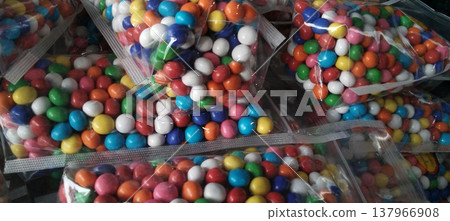 Colorful Candy-Coated Chocolates in Plastic Packaging Colorful Candy-Coated Chocolates in Plastic Packaging 137966908