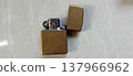 Antique Brass Lighter on Marble Surface 137966962