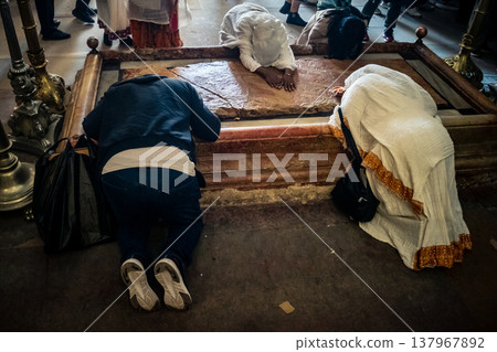 Orthodox priest standing in the Church of the Holy Sepulchre in Jerusalem. 137967892