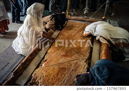 Orthodox priest standing in the Church of the Holy Sepulchre in Jerusalem. Orthodox priest standing in the Church of the Holy Sepulchre in Jerusalem. 137967893