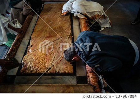 Orthodox priest standing in the Church of the Holy Sepulchre in Jerusalem. 137967894