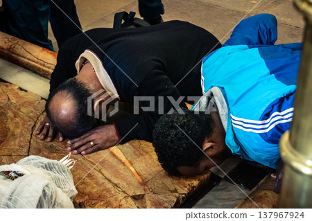 Orthodox priest standing in the Church of the Holy Sepulchre in Jerusalem. 137967924
