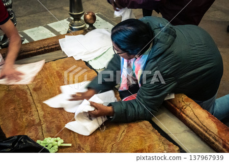 Orthodox priest standing in the Church of the Holy Sepulchre in Jerusalem. 137967939
