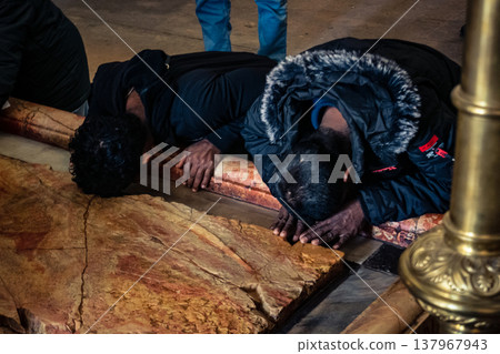 Orthodox priest standing in the Church of the Holy Sepulchre in Jerusalem. 137967943