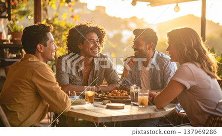 A dining lifestyle of friends enjoying conversation in warm light. A dining lifestyle of friends enjoying conversation in warm light. 137969286