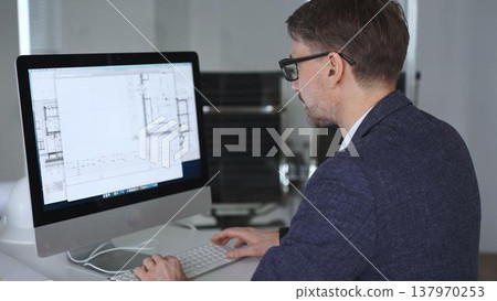 Architect developing building blueprint on computer, engineering and urban planning a new construction project. Business and architecture concept 137970253
