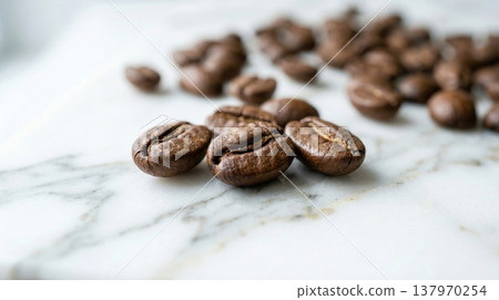 Close up of roasted coffee beans on marble surface. Perfect for coffee shop, cafe, or coffee related designs. 137970254