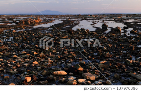 Evening scenery on a shallow, folded coastline Evening scenery on a shallow, folded coastline 137970386