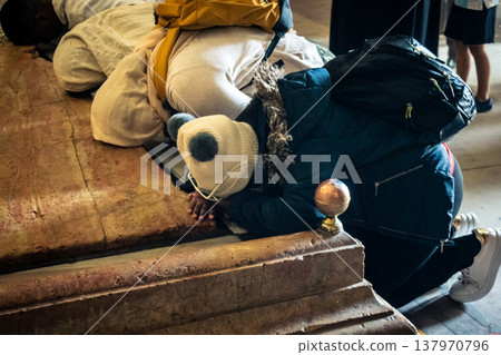 Christian pilgrims' hands on the Stone of Anointing, Holy Sepulchre. Christian pilgrims' hands on the Stone of Anointing, Holy Sepulchre. 137970796