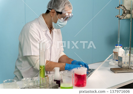 Chemical scientist are experimenting with various chemicals Chemical scientist are experimenting with various chemicals 137971606