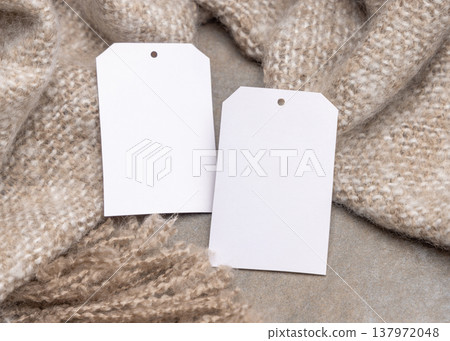 Blank vertical gift tags mockup on beige plaid, copy space. Handmade product label design Blank vertical gift tags mockup on beige plaid, copy space. Handmade product label design 137972048