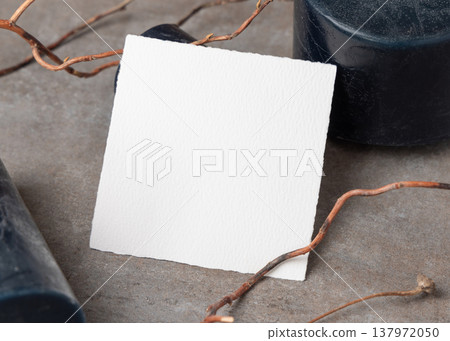Blank square card mockup on grey stone with dry branches and candles. Minimal stationery template Blank square card mockup on grey stone with dry branches and candles. Minimal stationery template 137972050