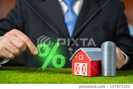 A farm and green interest in the hands of a businessman. Cheap loans for agribusiness and rural development. Agricultural financing boosts production. Supporting farmers with subsidies and investment A farm and green interest in the hands of a businessman. Cheap loans for agribusiness and rural development. Agricultural financing boosts production. Supporting farmers with subsidies and investment 137972203