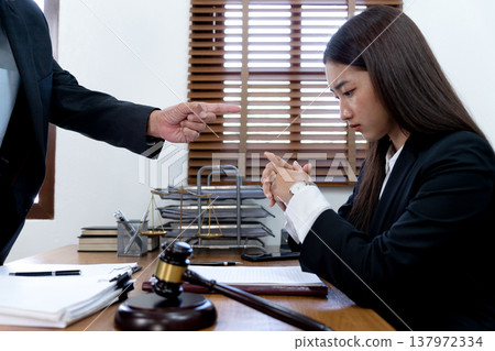The boss is pointing in the face at the helper who misbehaved The boss is pointing in the face at the helper who misbehaved 137972334