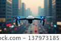 Close-up of a quadcopter with a high-resolution camera flying over a city at dusk 137973185