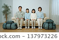 Family sitting in the living room 137973226