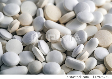 Heap of medicine white pills macro shot Heap of medicine white pills macro shot 137973260