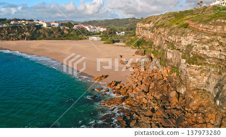 Beautiful coastline seascape in Europe.  Beautiful rocky seascape with rolling waves to the shore. Aerial view: beautiful nature landscape. Drone view of scenic nature  in Portugal. 137973280