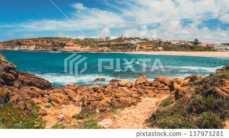Beautiful sandy beach on summer sunny day with azure water. Aerial view: beach with white sand and blue water. Drone view of scenic nature  in Portugal. Beautiful seascape in Europe 137973281
