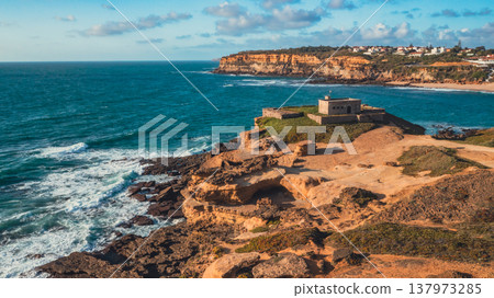Beautiful coastline seascape in Europe. Beautiful rocky seascape with rolling waves to the shore. Aerial view: beautiful nature landscape. Drone view of scenic nature in Portugal. Beautiful coastline seascape in Europe. Beautiful rocky seascape with rolling waves to the shore. Aerial view: beautiful nature landscape. Drone view of scenic nature in Portugal. 137973285