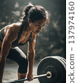 Strong Asian Woman Lifting Barbell in Gym Powerful Fitness Action 137974160