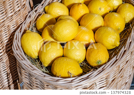 fresh lemons in basket close-up 137974328
