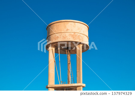 water tower on a blue sky background 137974329
