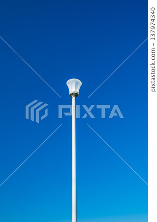 lamppost on a blue sky background lamppost on a blue sky background 137974340