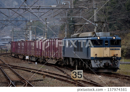 EF641033 container freight train running on the Hakubi Line 137974381