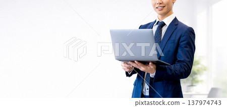Male businessman with laptop Male businessman with laptop 137974743